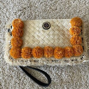 Tory Burch Cream and Orange Straw Clutch w/ Pom Pom’s. New w/o tags. Sold out!